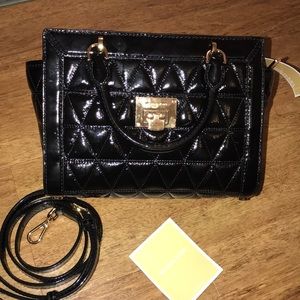 Micheal kors black shiny leather bag.